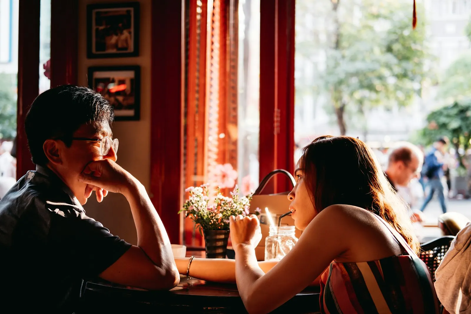 Man and woman chatting across a table on a first date