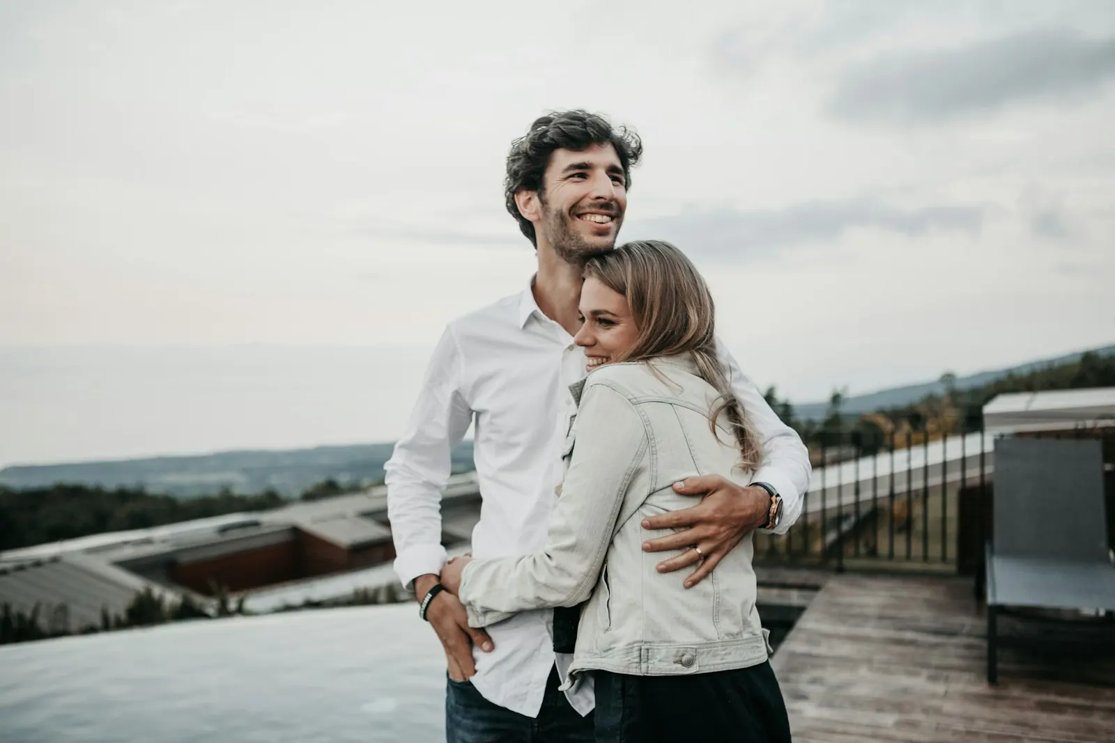 Smiling couple hugging outdoors