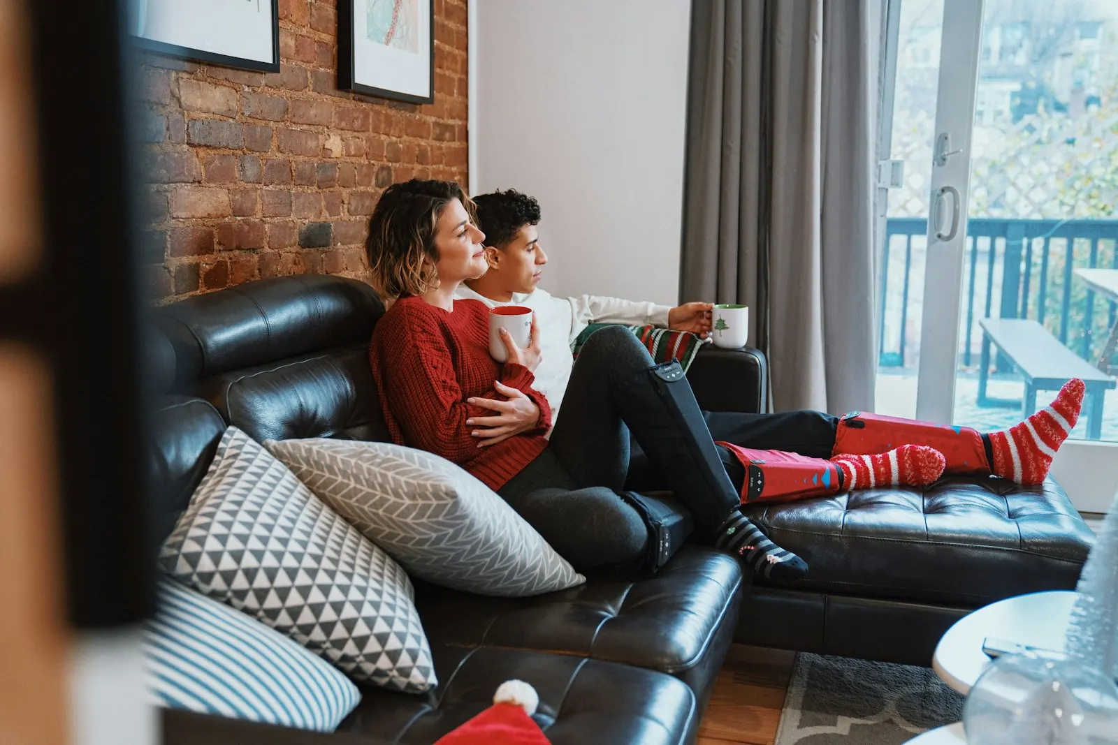 Couple relaxing together on a couch at home