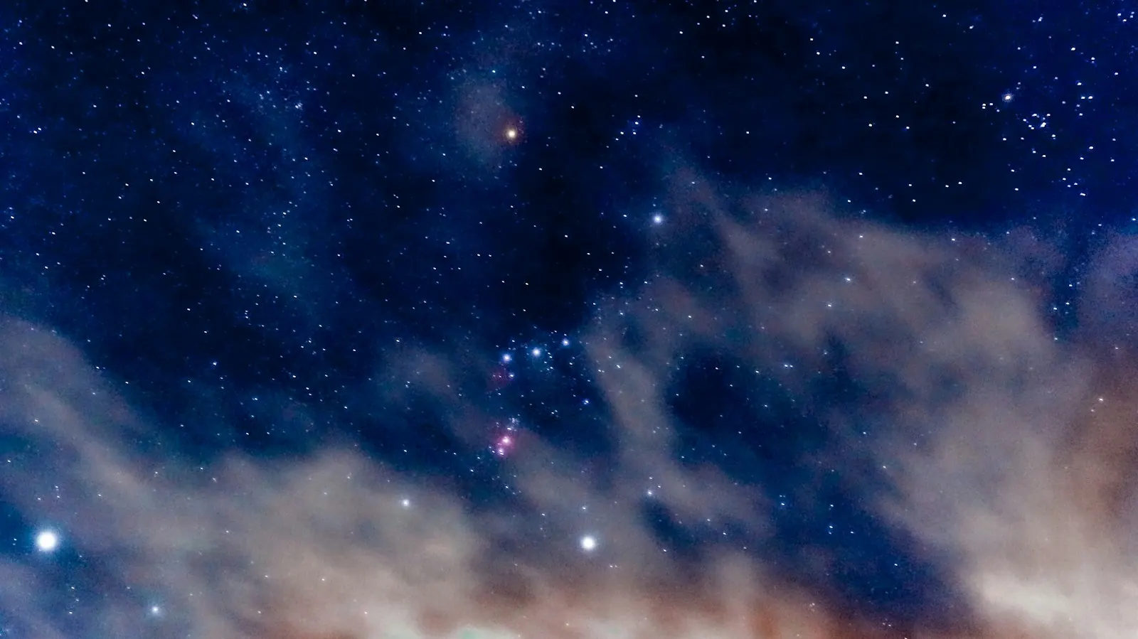 Deep blue night sky filled with stars and constellations